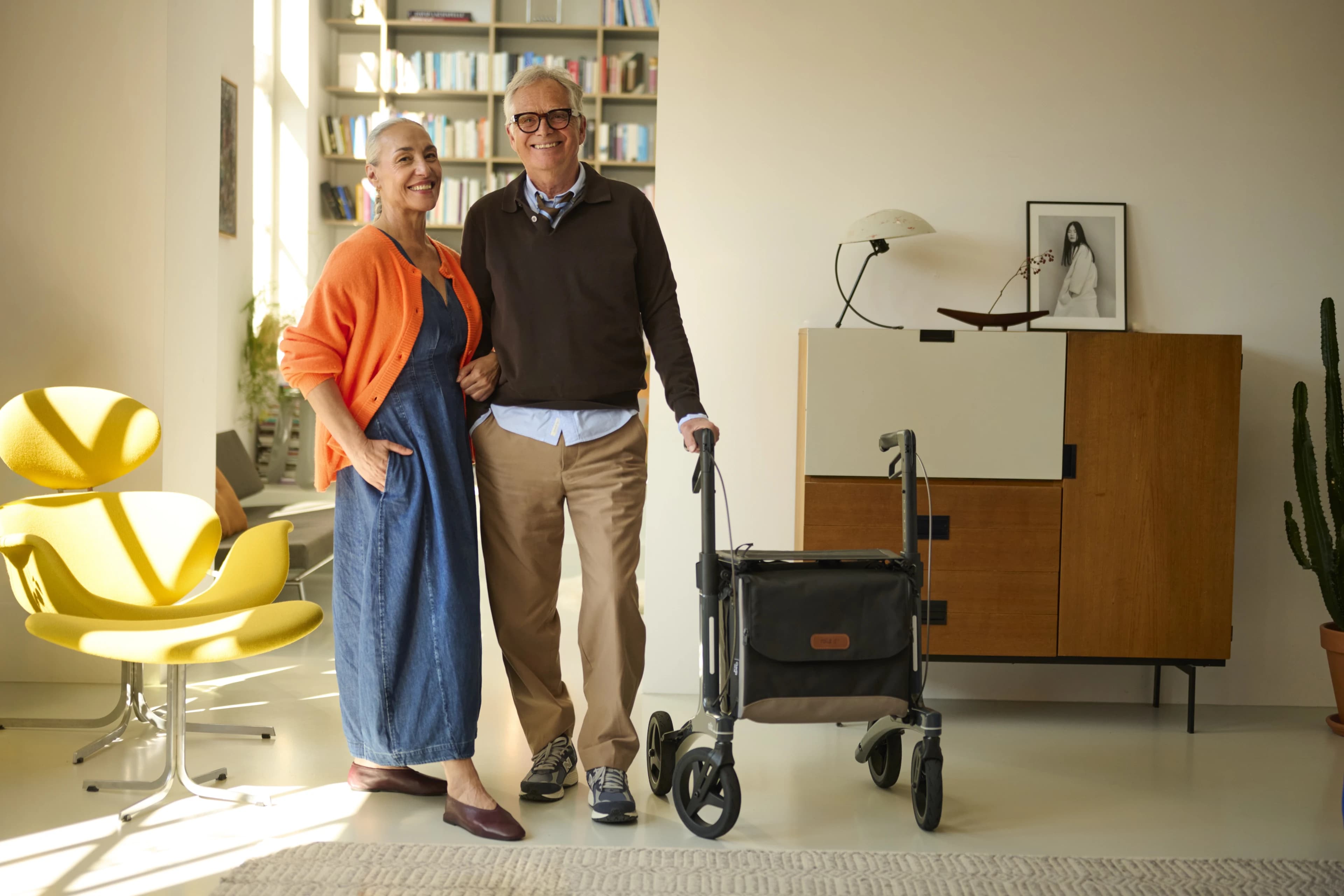 A Rollz rollator resting in a warmly lit interior.